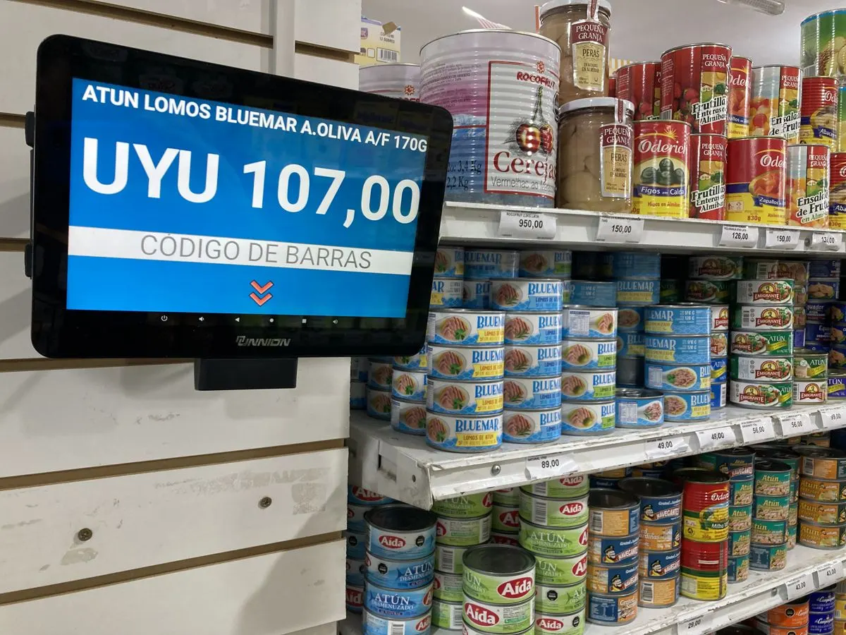 Price checker on a supermarket shelf
